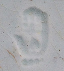 Pearlware painted underglaze London shape cup and matching saucer with leaf motif. Impressed hand mark on reverse of saucer has been associated with the firm of John and Richard Riley , in operation in Burslem from 1802-1828 (Pomfret 2005). 3.75” cup rim diameter;  2.5” cup height.