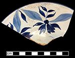 Pearlware painted underglaze London shape cup and matching saucer with floral motif.  This vessel is one of four matching cups and saucers from this privy.  Each of the three cups contains the same x-shaped workman’s mark.  3.5” cup rim diameter; 6.0”saucer rim diameter; 2.5” cup height.
