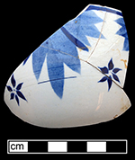 Pearlware painted underglaze ? shape cup and matching saucer with star or floral motif.   Impressed maker’s mark on reverse of saucer:  Davenport and anchor, mark used c. 1793-1810. Approx. 3.0” cup rim diameter; 6.0” saucer rim diameter.
